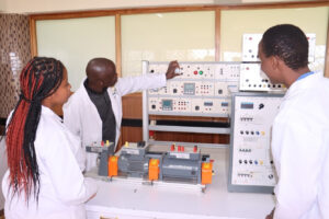 Lecture with students dueing a practical session at DeKUT