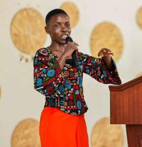 Roseline Alionya speaking in a public meeting